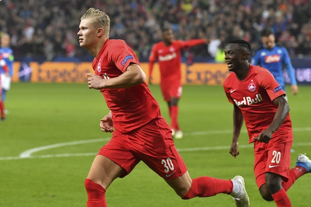 Salzburg's Erling Braut Haaland, left, celebrates after scoring the opening goal during the Champions League Group E soccer match between FC Red Bull Salzburg and Napoli in Salzburg, Austria, Wednesday, Oct. 23, 2019. (AP Photo/Kerstin Joensson)