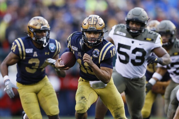 Navy quarterback Malcolm Perry runs the ball for a touchdown against Army during the first half of an NCAA college football game, Saturday, Dec. 14, 2019, in Philadelphia. (AP Photo/Matt Slocum)