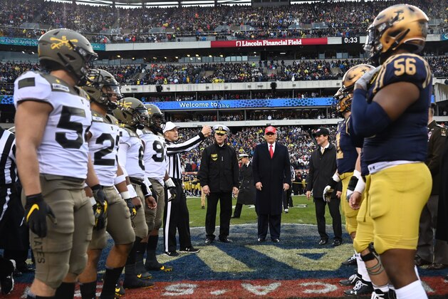 US President Donald Trump (C) participates in the coin toss coin before the Army v. Navy American Football game in Philadelphia on December 14, 2019. (Photo by Andrew Caballero-Reynolds / AFP) (Photo by ANDREW CABALLERO-REYNOLDS/AFP via Getty Images)