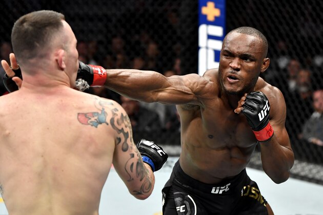 LAS VEGAS, NEVADA - DECEMBER 14:  (R-L) Kamaru Usman of Nigeria strikes Colby Covington in their UFC welterweight championship bout during the UFC 245 event at T-Mobile Arena on December 14, 2019 in Las Vegas, Nevada. (Photo by Jeff Bottari/Zuffa LLC via Getty Images)