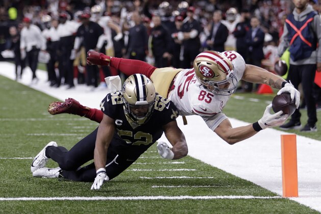 San Francisco 49ers tight end George Kittle (85) dives to the pylon for a touchdown against New Orleans Saints linebacker Craig Robertson (52) in the second half an NFL football game in New Orleans, Sunday, Dec. 8, 2019. (AP Photo/Brett Duke) San Francisco 49ers tight end George Kittle (85) dives to the pylon for a touchdown against New Orleans Saints linebacker Craig Robertson (52) in the second half an NFL football game in New Orleans, Sunday, Dec. 8, 2019. (AP Photo/Brett Duke)