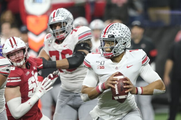 Ohio State quarterback Justin Fields, right, looks to throw during the second half of the Big Ten championship NCAA college football game against Wisconsin, Saturday, Dec. 7, 2019, in Indianapolis. (AP Photo/AJ Mast)