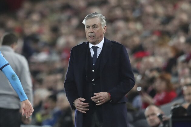 Napoli's head coach Carlo Ancelotti watches during the Champions League Group E soccer match between Liverpool and Napoli at Anfield stadium in Liverpool, England, Wednesday, Nov. 27, 2019. (AP Photo/Jon Super)