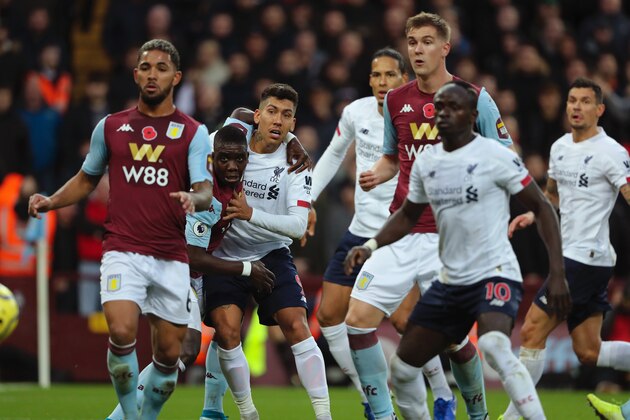 BIRMINGHAM, ENGLAND - NOVEMBER 02: Roberto Firmino of Liverpool is held back during a corner during the Premier League match between Aston Villa and Liverpool FC at Villa Park on November 2, 2019 in Birmingham, United Kingdom. (Photo by Matthew Ashton - AMA/Getty Images)