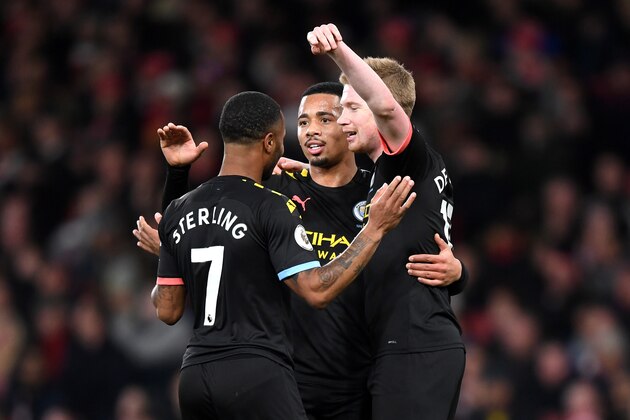 LONDON, ENGLAND - DECEMBER 15: Raheem Sterling of Manchester City celebrates with teammates Kevin De Bruyne and Gabriel Jesus after scoring his team's second goal during the Premier League match between Arsenal FC and Manchester City at Emirates Stadium on December 15, 2019 in London, United Kingdom. (Photo by Shaun Botterill/Getty Images)