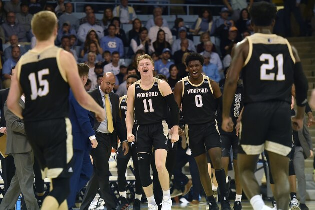 CHAPEL HILL, NORTH CAROLINA - DECEMBER 15: Ryan Larson #11 of the Wofford Terriers and Zion Richardson #0 of the Wofford Terriers react following a play against the North Carolina Tar Heels during their game at Carmichael Arena on December 15, 2019 in Chapel Hill, North Carolina. (Photo by Jared C. Tilton/Getty Images)
