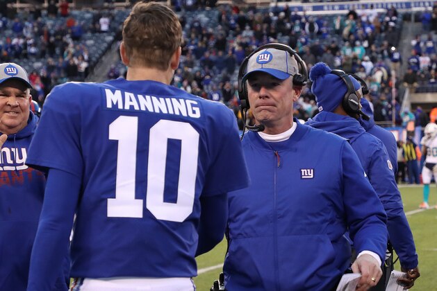 EAST RUTHERFORD, NEW JERSEY - DECEMBER 15:  Eli Manning #10 of the New York Giants hugs head coach Pat Shurmur of the New York Giants in the final seconds of their 31-13 win against the Miami dolphins at MetLife Stadium on December 15, 2019 in East Rutherford, New Jersey. (Photo by Al Bello/Getty Images)