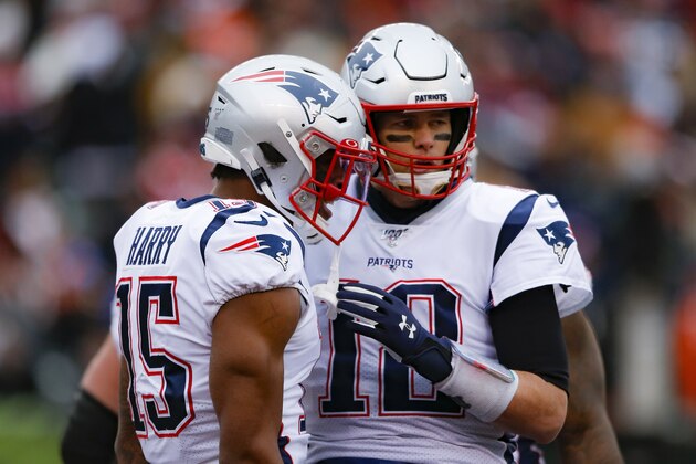 New England Patriots wide receiver N'Keal Harry (15) celebrates his touchdown with quarterback Tom Brady (12) in the second half of an NFL football game against the Cincinnati Bengals, Sunday, Dec. 15, 2019, in Cincinnati. (AP Photo/Gary Landers)
