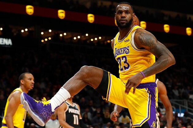 ATLANTA, GEORGIA - DECEMBER 15:  LeBron James #23 of the Los Angeles Lakers reacts after dunking against the Atlanta Hawks in the first half at State Farm Arena on December 15, 2019 in Atlanta, Georgia.  NOTE TO USER: User expressly acknowledges and agrees that, by downloading and/or using this photograph, user is consenting to the terms and conditions of the Getty Images License Agreement.  (Photo by Kevin C. Cox/Getty Images)
