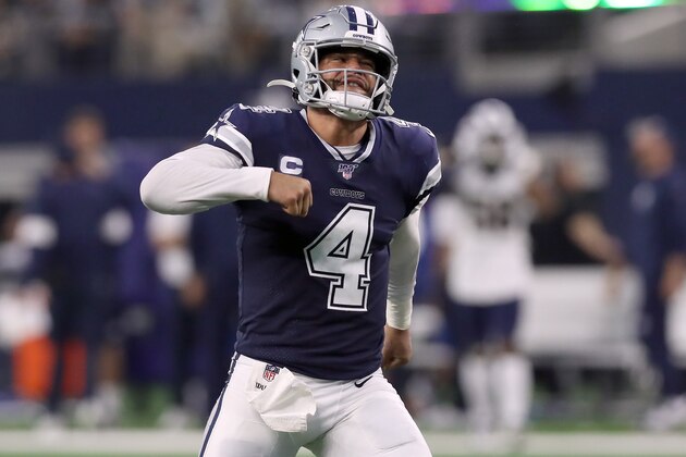 ARLINGTON, TEXAS - DECEMBER 15: Dak Prescott #4 of the Dallas Cowboys celebrates after the Dallas Cowboys score a touchdown  against the Los Angeles Rams in the second quarter at AT&T Stadium on December 15, 2019 in Arlington, Texas. (Photo by Tom Pennington/Getty Images)