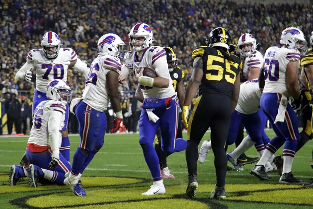 Buffalo Bills quarterback Josh Allen, center, scores on a one-yard run during the first half of an NFL football game against the Pittsburgh Steelers in Pittsburgh, Sunday, Dec. 15, 2019. (AP Photo/Don Wright)