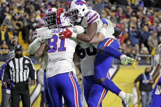 Buffalo Bills tight end Tyler Kroft (81) celebrates with running back Devin Singletary (26) and others after scoring on a pass from quarterback Josh Allen during the second half of an NFL football game against the Pittsburgh Steelers in Pittsburgh, Sunday, Dec. 15, 2019. (AP Photo/Don Wright)