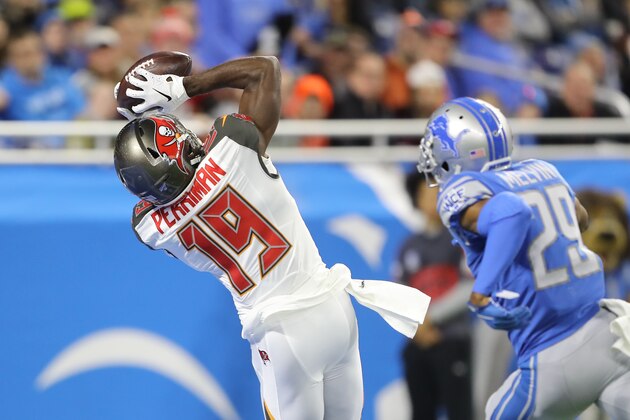 DETROIT, MI - DECEMBER 15: Breshad Perriman #19 of the Tampa Bay Buccaneers catches a first quarter touchdown pass in front of Rashaan Melvin #29 of the Detroit Lions at Ford Field on December 15, 2019 in Detroit, Michigan. (Photo by Rey Del Rio/Getty Images)