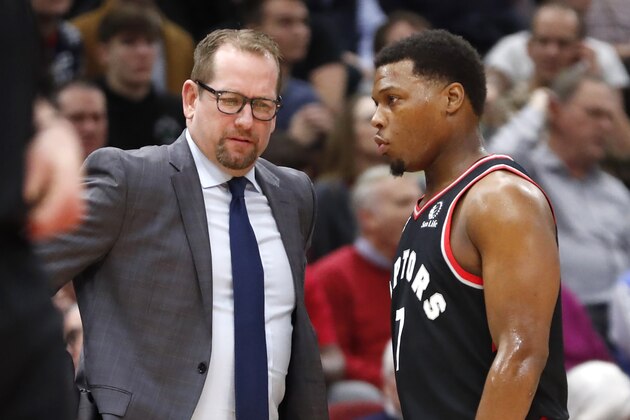 Toronto Raptors head coach Nick Nurse, left, listens to Kyle Lowry during the first half of an NBA basketball game against the Chicago Bulls Monday, Dec. 9, 2019, in Chicago. (AP Photo/Charles Rex Arbogast)