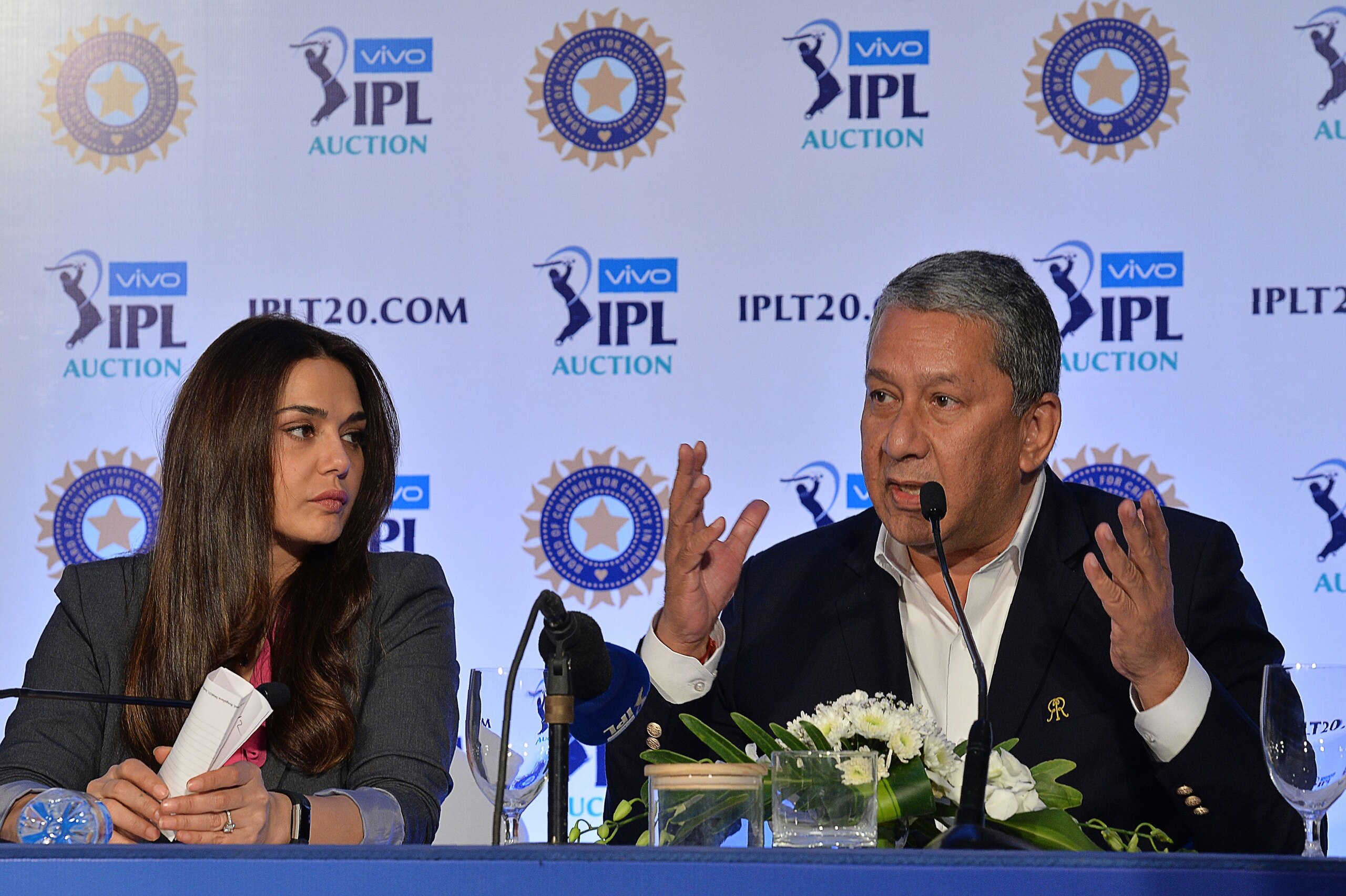 Bollywood actress and owner of Kings XI Punjab Team, Preity Zinta (L) looks on as Chairman & CEO, Rajasthan Royals, Ranjit Barthakur addresses a press conference during the 2nd day of IPL 2018 Player Auction in Bangalore on January 28, 2018. / AFP PHOTO / MANJUNATH KIRAN        (Photo credit should read MANJUNATH KIRAN/AFP via Getty Images)