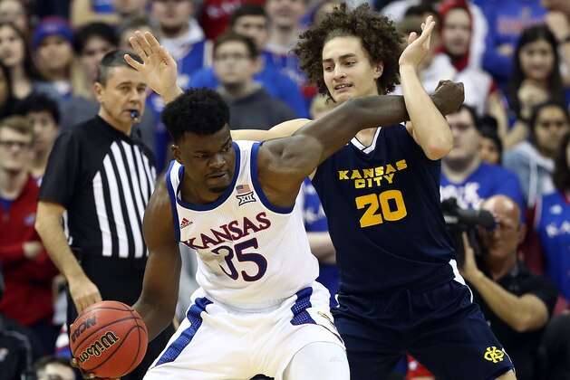 LAWRENCE, KANSAS - DECEMBER 14:  Udoka Azubuike #35 of the Kansas Jayhawks controls the ball as Josiah Allick #20 of the UMKC Kangaroos defends during the game at Allen Fieldhouse on December 14, 2019 in Lawrence, Kansas. (Photo by Jamie Squire/Getty Images)