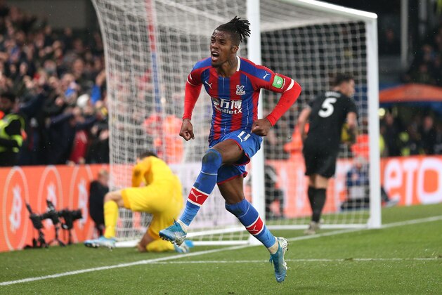 LONDON, ENGLAND - DECEMBER 16: Wilfried Zaha of Crystal Palace celebrates after scoring his sides first goal during the Premier League match between Crystal Palace and Brighton & Hove Albion at Selhurst Park on December 16, 2019 in London, United Kingdom. (Photo by Alex Pantling/Getty Images)