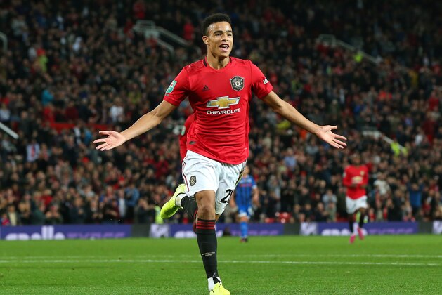 MANCHESTER, ENGLAND - SEPTEMBER 25: Mason Greenwood of Manchester United celebrates scoring his teams first goal of the game during the Carabao Cup Third Round match between Manchester United and Rochdale at Old Trafford on September 25, 2019 in Manchester, England. (Photo by Alex Livesey/Getty Images)