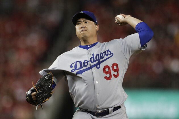 Los Angeles Dodgers starting pitcher Hyun-Jin Ryu throws to a Washington Nationals batter during the first inning in Game 3 of a baseball National League Division Series on Sunday, Oct. 6, 2019, in Washington. (AP Photo/Julio Cortez)