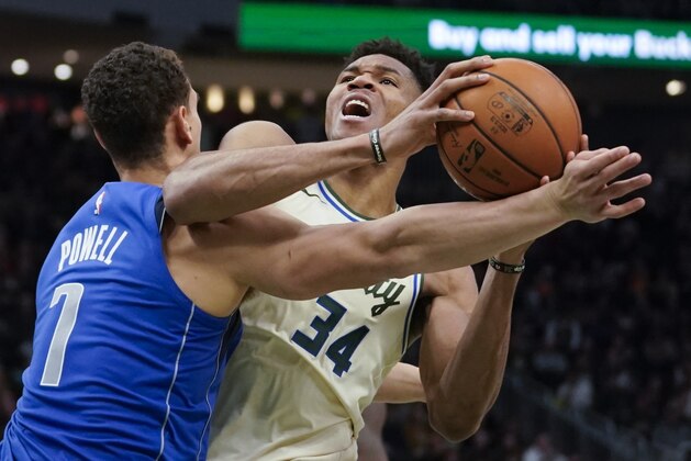 Milwaukee Bucks' Giannis Antetokounmpo tries to get past Dallas Mavericks' Dwight Powell during the second half of an NBA basketball game Monday, Dec. 16, 2019, in Milwaukee. The Mavericks won 120-116. (AP Photo/Morry Gash) Milwaukee Bucks' Giannis Antetokounmpo tries to get past Dallas Mavericks' Dwight Powell during the second half of an NBA basketball game Monday, Dec. 16, 2019, in Milwaukee. The Mavericks won 120-116. (AP Photo/Morry Gash)