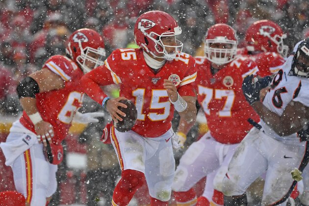 KANSAS CITY, MO - DECEMBER 15:  Quarterback Patrick Mahomes #15 of the Kansas City Chiefs rolls out against the Denver Broncos during the second half at Arrowhead Stadium on December 15, 2019 in Kansas City, Missouri. (Photo by Peter Aiken/Getty Images)
