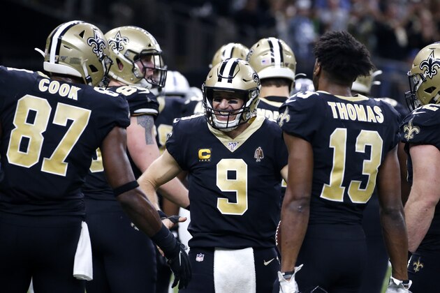 New Orleans Saints quarterback Drew Brees (9) celebrates his touchdown pass to tight end Josh Hill, which broke the NFL record for career touchdown passes, surpassing Peyton Manning, in the second half of an NFL football game against the Indianapolis Colts in New Orleans, Monday, Dec. 16, 2019. (AP Photo/Butch Dill)