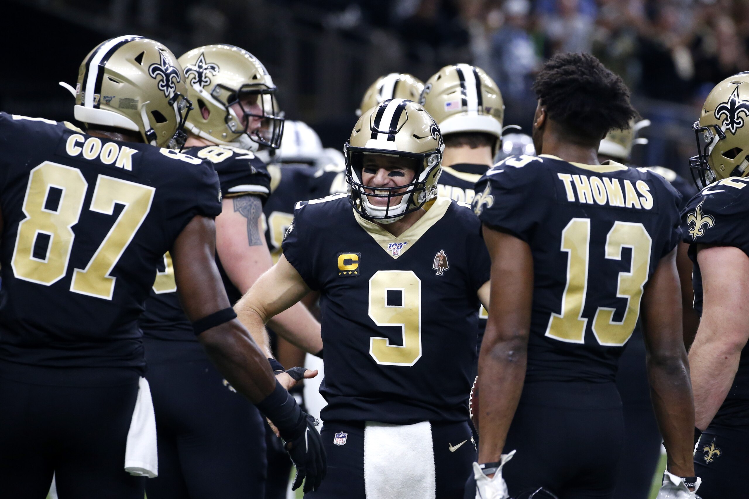 New Orleans Saints quarterback Drew Brees (9) celebrates his touchdown pass to tight end Josh Hill, which broke the NFL record for career touchdown passes, surpassing Peyton Manning, in the second half of an NFL football game against the Indianapolis Colts in New Orleans, Monday, Dec. 16, 2019. (AP Photo/Butch Dill)