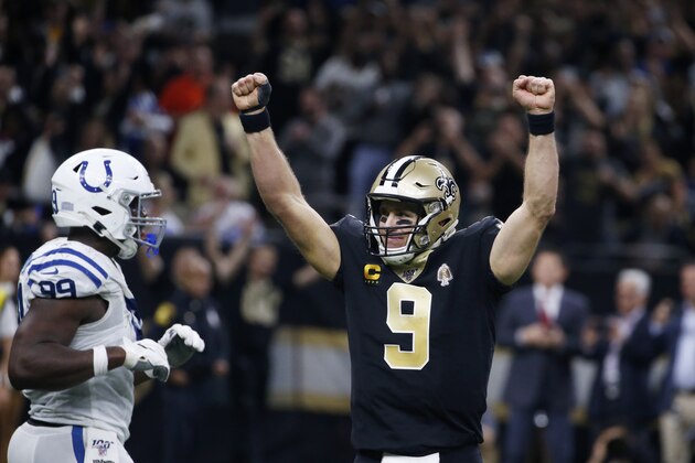 New Orleans Saints quarterback Drew Brees (9) celebrates his touchdown pass to tight end Josh Hill, which broke the NFL record for career touchdown passes, surpassing Peyton Manning, in the second half of an NFL football game against the Indianapolis Colts in New Orleans, Monday, Dec. 16, 2019. (AP Photo/Butch Dill)