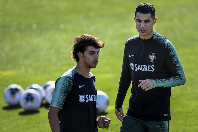 Portugal's forwards Cristiano Ronaldo (R) and Joao Felix attend a training session ahead of the Euro 2020 qualifier football match Portugal vs Luxembourg at the