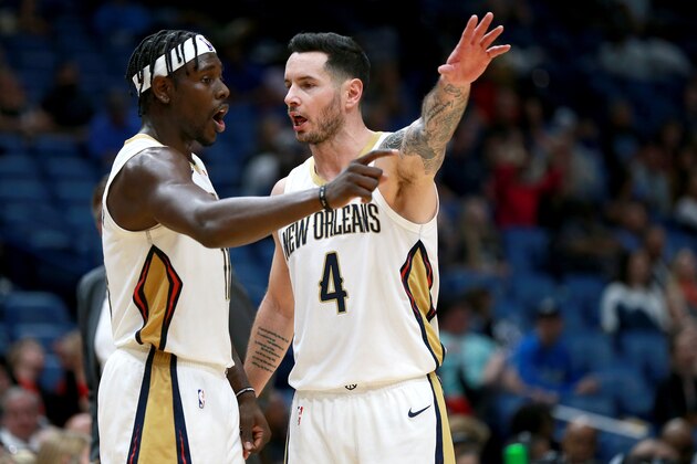 NEW ORLEANS, LOUISIANA - DECEMBER 15: Jrue Holiday #11 of the New Orleans Pelicans and JJ Redick #4 of the New Orleans Pelicans stand on the court during a NBA game against the Orlando Magic at Smoothie King Center on December 15, 2019 in New Orleans, Louisiana. NOTE TO USER: User expressly acknowledges and agrees that, by downloading and or using this photograph, User is consenting to the terms and conditions of the Getty Images License Agreement. (Photo by Sean Gardner/Getty Images)