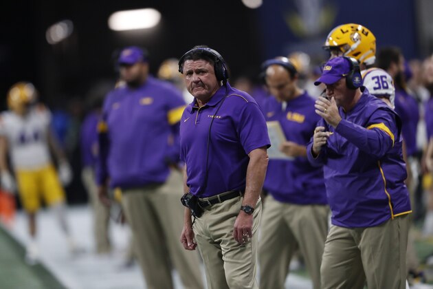 LSU head coach Ed Orgeron watches play against Georgia during the first half of the Southeastern Conference championship NCAA college football game, Saturday, Dec. 7, 2019, in Atlanta. (AP Photo/John Bazemore)