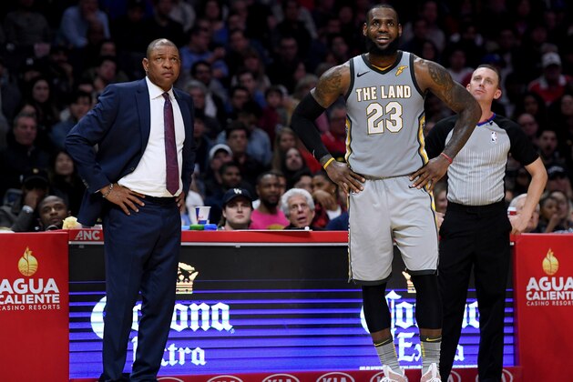 LOS ANGELES, CA - MARCH 09:  LeBron James #23 of the Cleveland Cavaliers and Doc Rivers of the LA Clippers react to a free throw during a 116-102 Clipper win at Staples Center on March 9, 2018 in Los Angeles, California.  (Photo by Harry How/Getty Images)