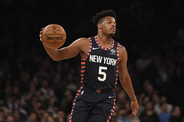 New York Knicks guard Dennis Smith Jr. (5) dribbles the ball during the first half of an NBA basketball game against the Boston Celtics, Sunday, Dec. 1, 2019, in New York. (AP Photo/Sarah Stier)