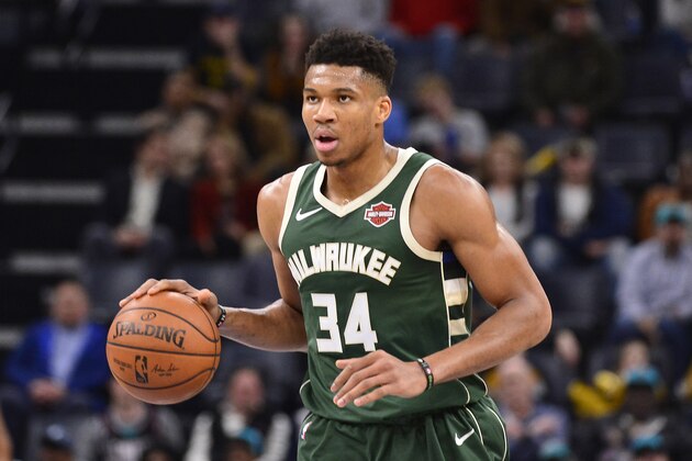 Milwaukee Bucks forward Giannis Antetokounmpo (34) brings the ball up court in the second half of an NBA basketball game against the Memphis Grizzlies Friday, Dec. 13, 2019, in Memphis, Tenn. (AP Photo/Brandon Dill)