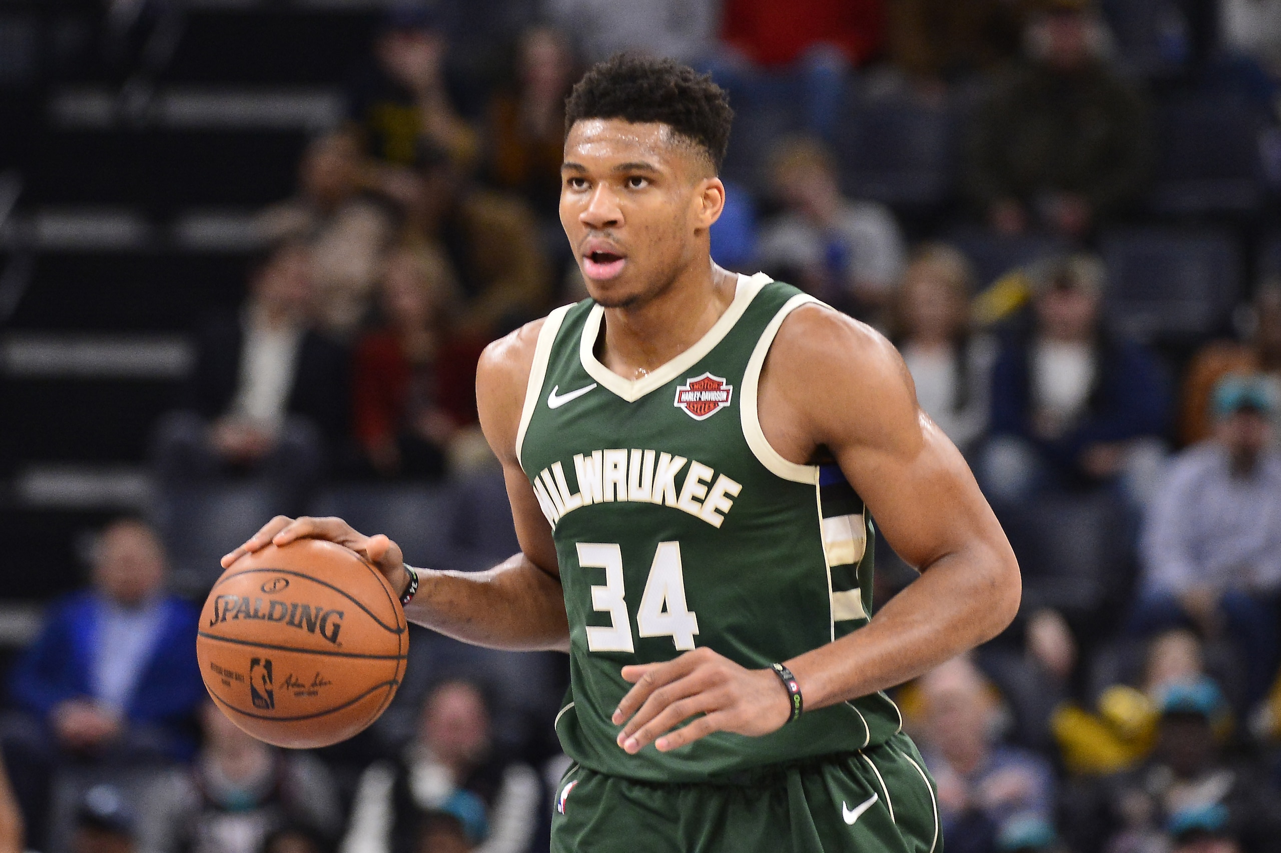 Milwaukee Bucks forward Giannis Antetokounmpo (34) brings the ball up court in the second half of an NBA basketball game against the Memphis Grizzlies Friday, Dec. 13, 2019, in Memphis, Tenn. (AP Photo/Brandon Dill)