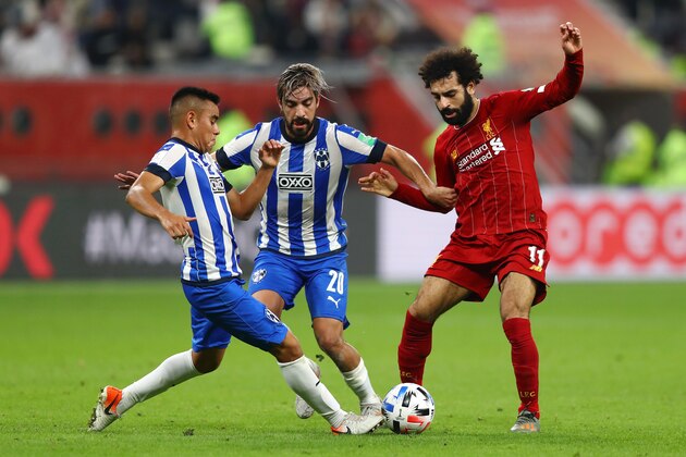 DOHA, QATAR - DECEMBER 18: Rodolfo Pizarro and Leonel Vangioni  of C.F. Monterrey battles for possession with Mohamed Salah of Liverpool  during the FIFA Club World Cup semi-final match between Monterrey and Liverpool at Education City Stadium on December 18, 2019 in Doha, Qatar. (Photo by Francois Nel/Getty Images)