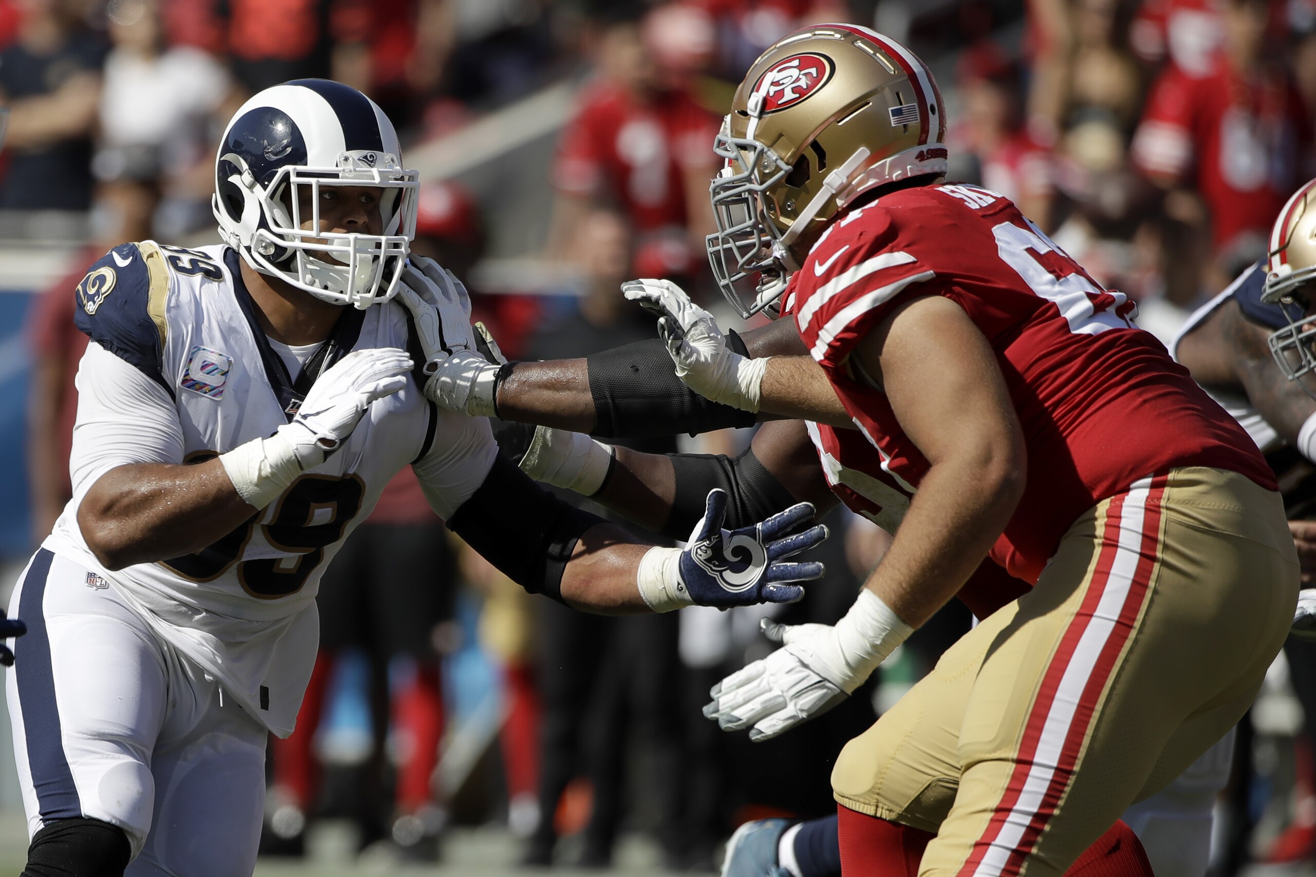 Los Angeles Rams defensive tackle Aaron Donald, left, battles San Francisco 49ers offensive tackle Justin Skule, right, during the first half of an NFL football game Sunday, Oct. 13, 2019, in Los Angeles. (AP Photo/Alex Gallardo) Los Angeles Rams defensive tackle Aaron Donald, left, battles San Francisco 49ers offensive tackle Justin Skule, right, during the first half of an NFL football game Sunday, Oct. 13, 2019, in Los Angeles. (AP Photo/Alex Gallardo)