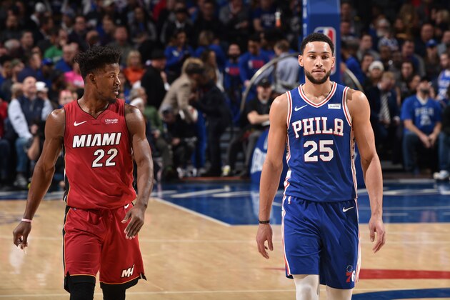 PHILADELPHIA, PA - DECEMBER 18: Jimmy Butler #22 of the Miami Heat and Ben Simmons #25 of the Philadelphia 76ers look on during a game on December 18, 2019 at the Wells Fargo Center in Philadelphia, Pennsylvania NOTE TO USER: User expressly acknowledges and agrees that, by downloading and/or using this Photograph, user is consenting to the terms and conditions of the Getty Images License Agreement. Mandatory Copyright Notice: Copyright 2019 NBAE (Photo by David Dow/NBAE via Getty Images)
