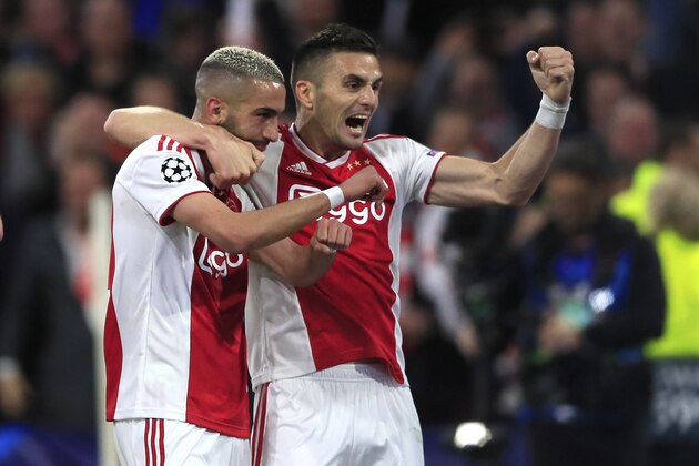 Ajax's Hakim Ziyech celebrates with Dusan Tadic, right,after scoring his side's second goal during the Champions League semifinal second leg soccer match between Ajax and Tottenham Hotspur at the Johan Cruyff ArenA in Amsterdam, Netherlands, Wednesday, May 8, 2019. (AP Photo/Peter Dejong)