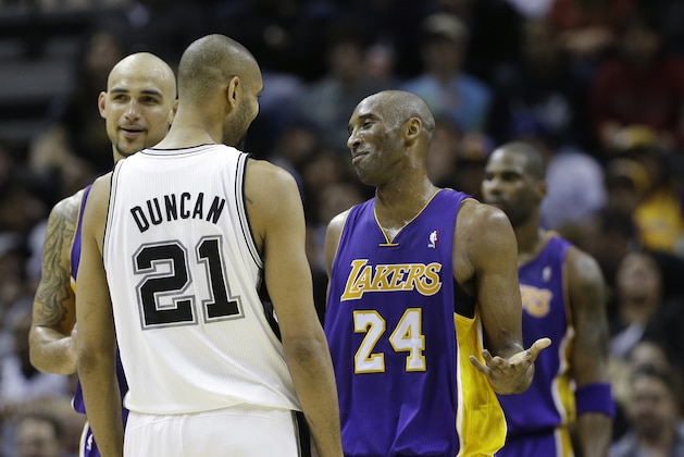 Los Angeles Lakers' Kobe Bryant (24) talks with San Antonio Spurs' Tim Duncan (21)during the fourth quarter of an NBA basketball game, Wednesday, Jan. 9, 2013, in San Antonio. San Antonio won 108-105. (AP Photo/Eric Gay)