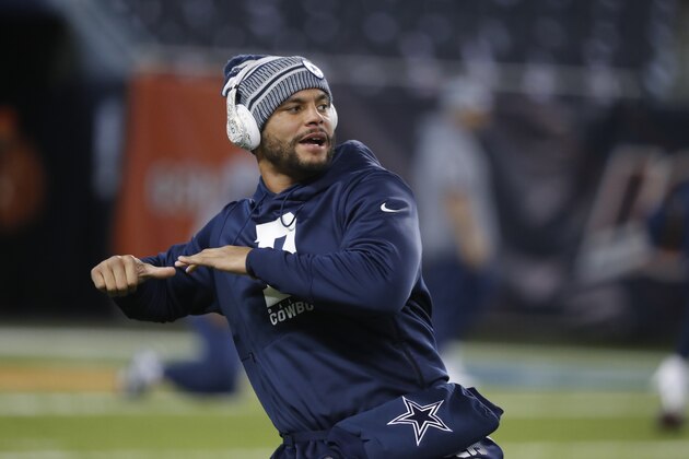 Dallas Cowboys quarterback Dak Prescott warms up before an NFL football game against the Chicago Bears, Thursday, Dec. 5, 2019, in Chicago. (AP Photo/Charles Rex Arbogast)