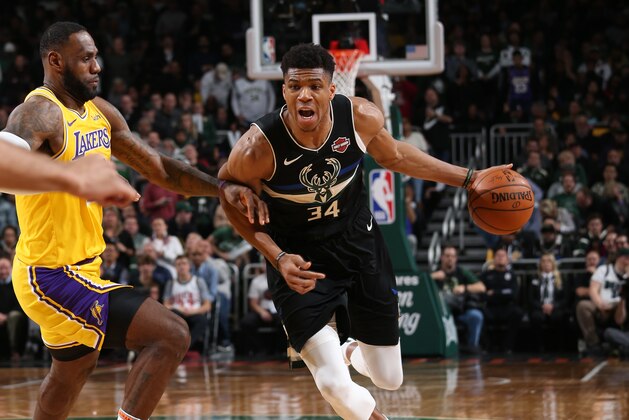 MILWAUKEE, WI - DECEMBER 19: Giannis Antetokounmpo #34 of the Milwaukee Bucks handles the ball against the Los Angeles Lakers on December 19, 2019 at the Fiserv Forum Center in Milwaukee, Wisconsin. NOTE TO USER: User expressly acknowledges and agrees that, by downloading and or using this Photograph, user is consenting to the terms and conditions of the Getty Images License Agreement. Mandatory Copyright Notice: Copyright 2019 NBAE (Photo by Gary Dineen/NBAE via Getty Images).