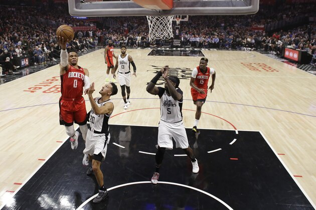 Houston Rockets' Russell Westbrook (0) drives to the basket against the Los Angeles Clippers during the first half of an NBA basketball game Thursday, Dec. 19, 2019, in Los Angeles. (AP Photo/Marcio Jose Sanchez)
