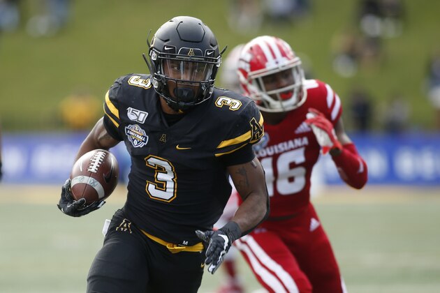 Appalachian State running back Darrynton Evans (3) evades Louisiana-Lafayette defensive back Percy Butler (16) as he runs for a touchdown during the first half of an NCAA college football game in the Sun Belt Football Championship on Saturday, Dec. 7, 2019, in Boone, N.C. (AP Photo/Brian Blanco)