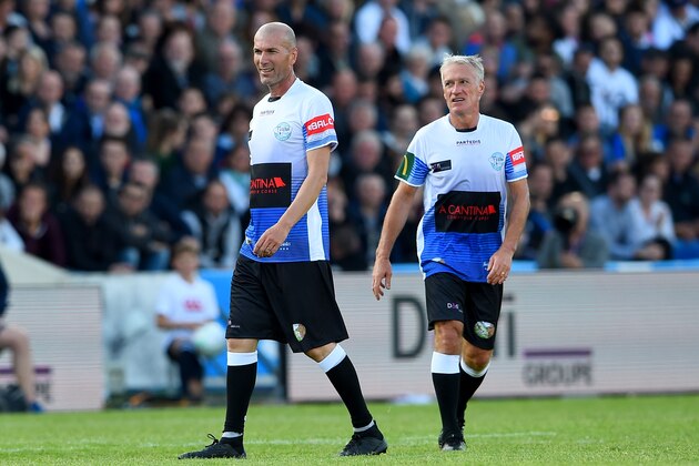 Real Madrid's French coach Zinedine Zidane (L) and Didier Deschamps looks on during a charity game with football and rugby legends on May 27, 2019 in Bordeaux, southwestern France. (Photo by NICOLAS TUCAT / AFP)        (Photo credit should read NICOLAS TUCAT/AFP via Getty Images)