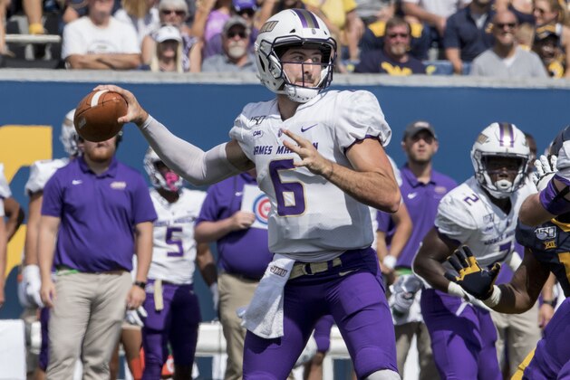 James Madison quarterback Ben DiNucci (6) attempt a pass during the first half of an NCAA college football game Saturday, Aug. 31, 2019, in Morgantown, W.Va. (AP Photo/Raymond Thompson)