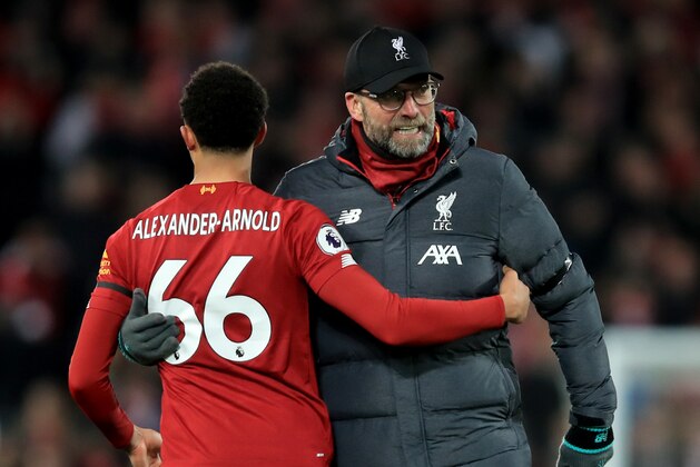 LIVERPOOL, ENGLAND - NOVEMBER 30: Jurgen Klopp manager of Liverpool with Trent Alexander-Arnold during the Premier League match between Liverpool FC and Brighton & Hove Albion at Anfield on November 30, 2019 in Liverpool, United Kingdom. (Photo by Marc Atkins/Getty Images)