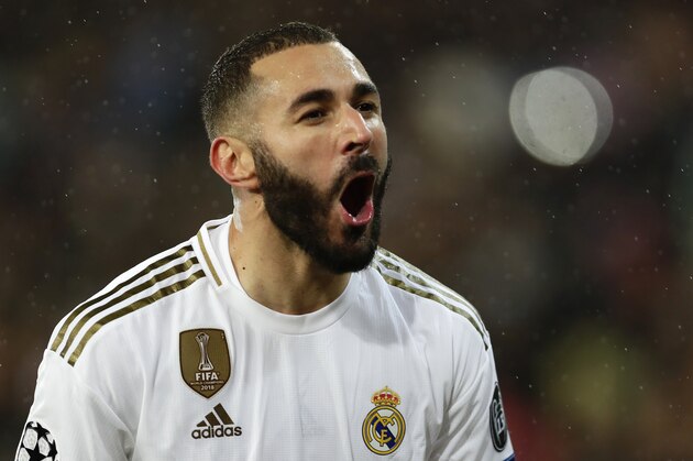 Real Madrid's Karim Benzema celebrates after scoring his side's opening goal during a Champions League soccer match Group A between Real Madrid and Paris Saint Germain at the Santiago Bernabeu stadium in Madrid, Spain, Tuesday, Nov. 26, 2019. (AP Photo/Manu Fernandez)