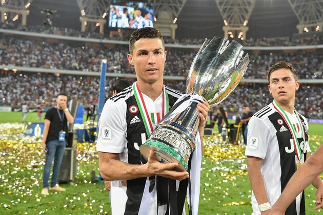 Juventus' Portuguese forward Cristiano Ronaldo holds the Supercoppa Italiana trophy after their final win against AC Milan at the King Abdullah Sports City Stadium in the  Saudi coastal city of Jeddah on January 16, 2019. (Photo by - / AFP)        (Photo credit should read -/AFP via Getty Images)