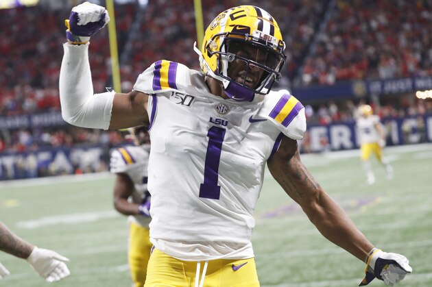 FILE - In this Dec. 7, 2019, file photo, LSU wide receiver Ja'Marr Chase (1) celebrates his touchdown against Georgia during the first half of the Southeastern Conference championship NCAA college football game, in Atlanta. Ja'Marr Chase  was one of three players from LSUâ€™s high-powered offense to earn unanimous first-team all-SEC honors when The Associated Press All-Southeastern Conference football team was announced Monday, Dec. 9, 2019. (AP Photo/John Bazemore, File)